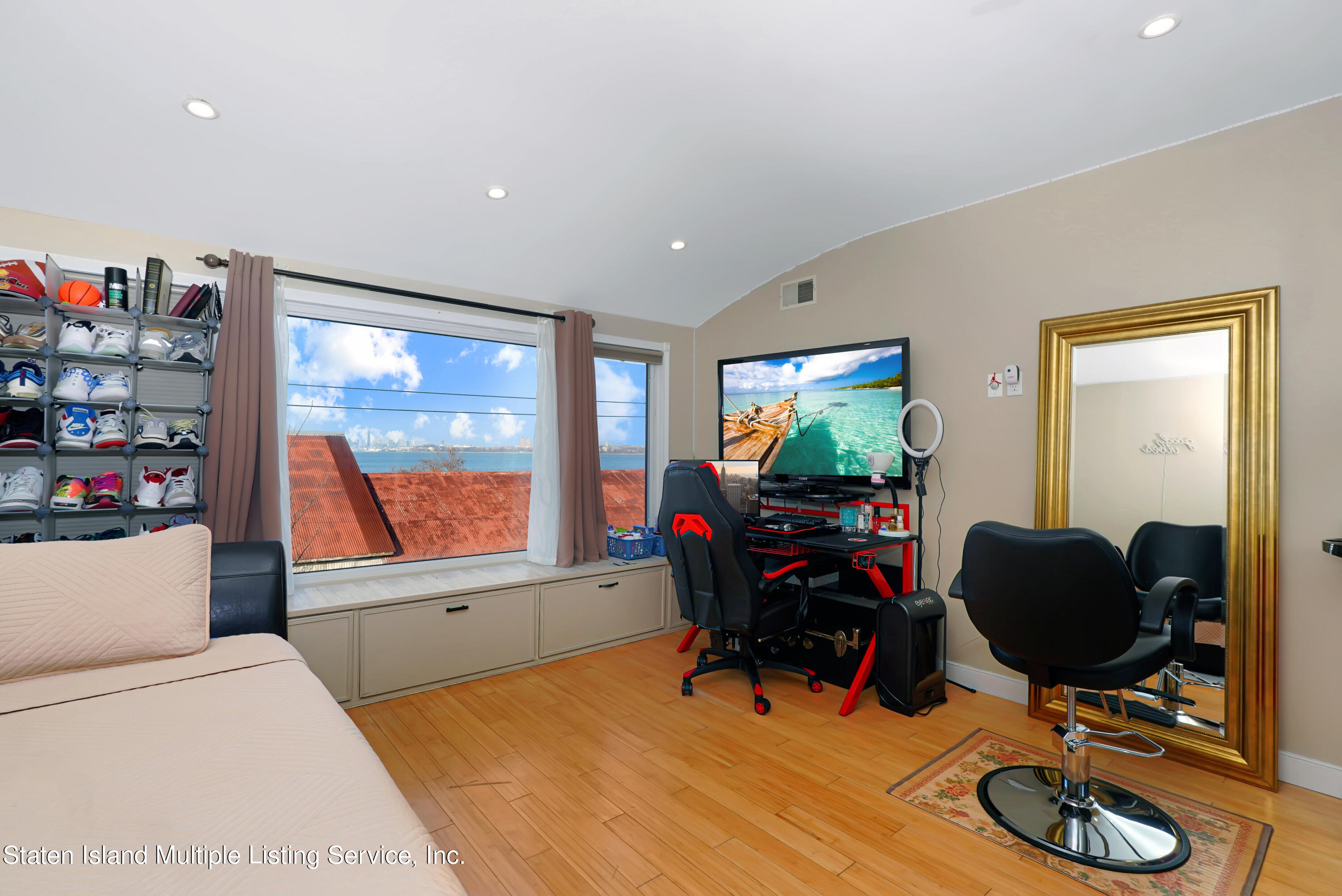 258 Edgewater Street Staten Island, NY 10305 - Photo 20 of 33 a living room with furniture and a flat screen tv