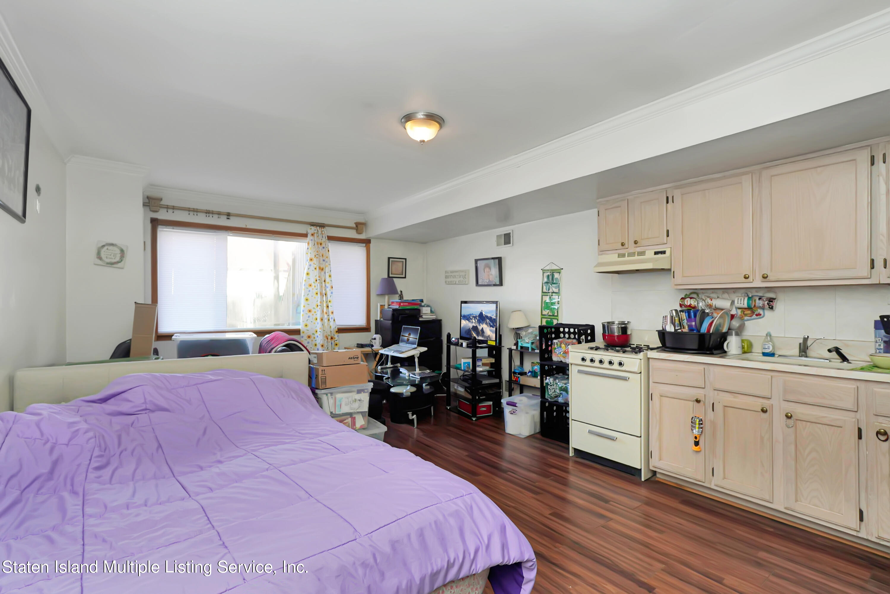 258 Edgewater Street Staten Island, NY 10305 - Photo 26 of 33 a bed room with a bed and a window