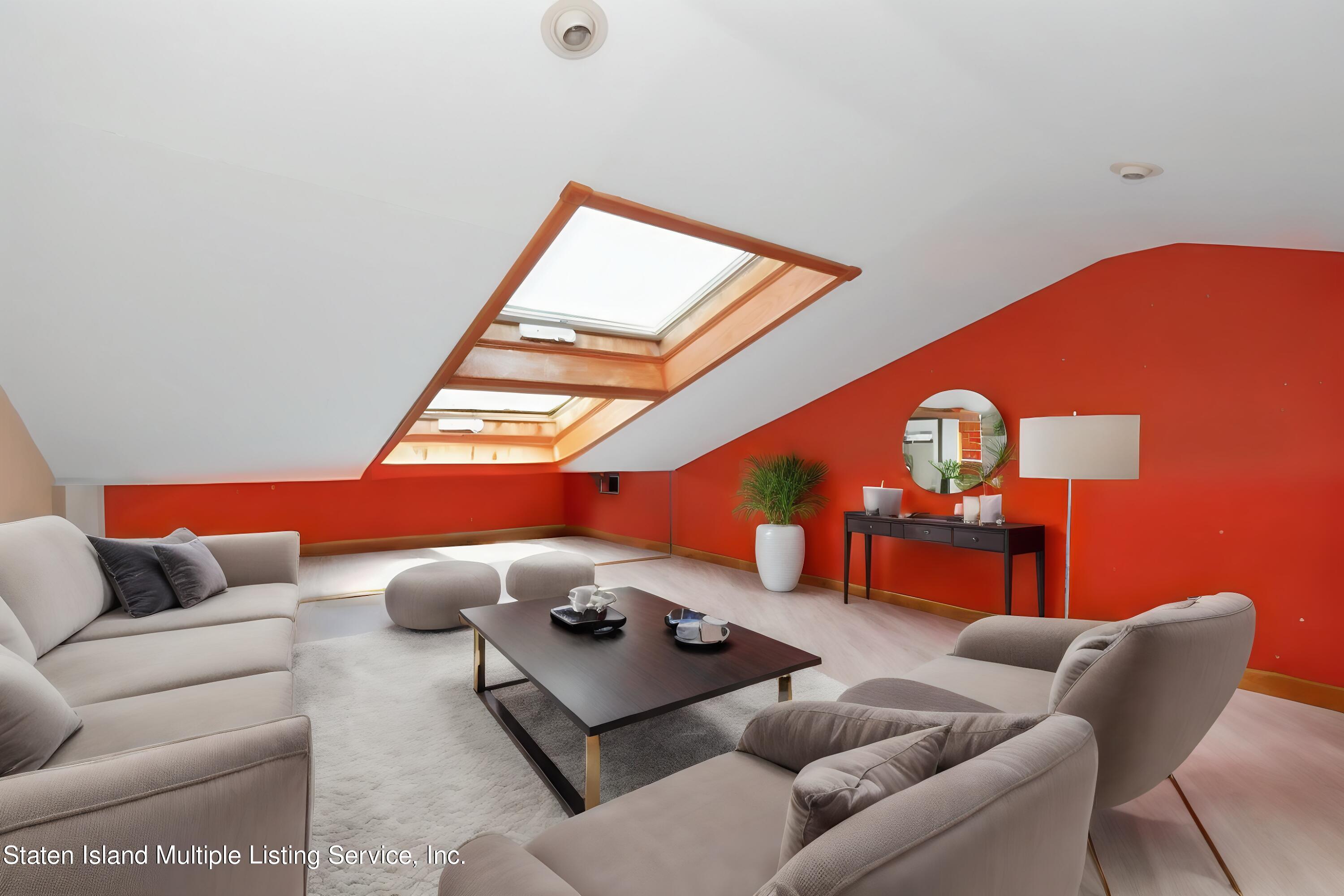 258 Edgewater Street Staten Island, NY 10305 - Photo 31 of 33 a living room with furniture and a large window