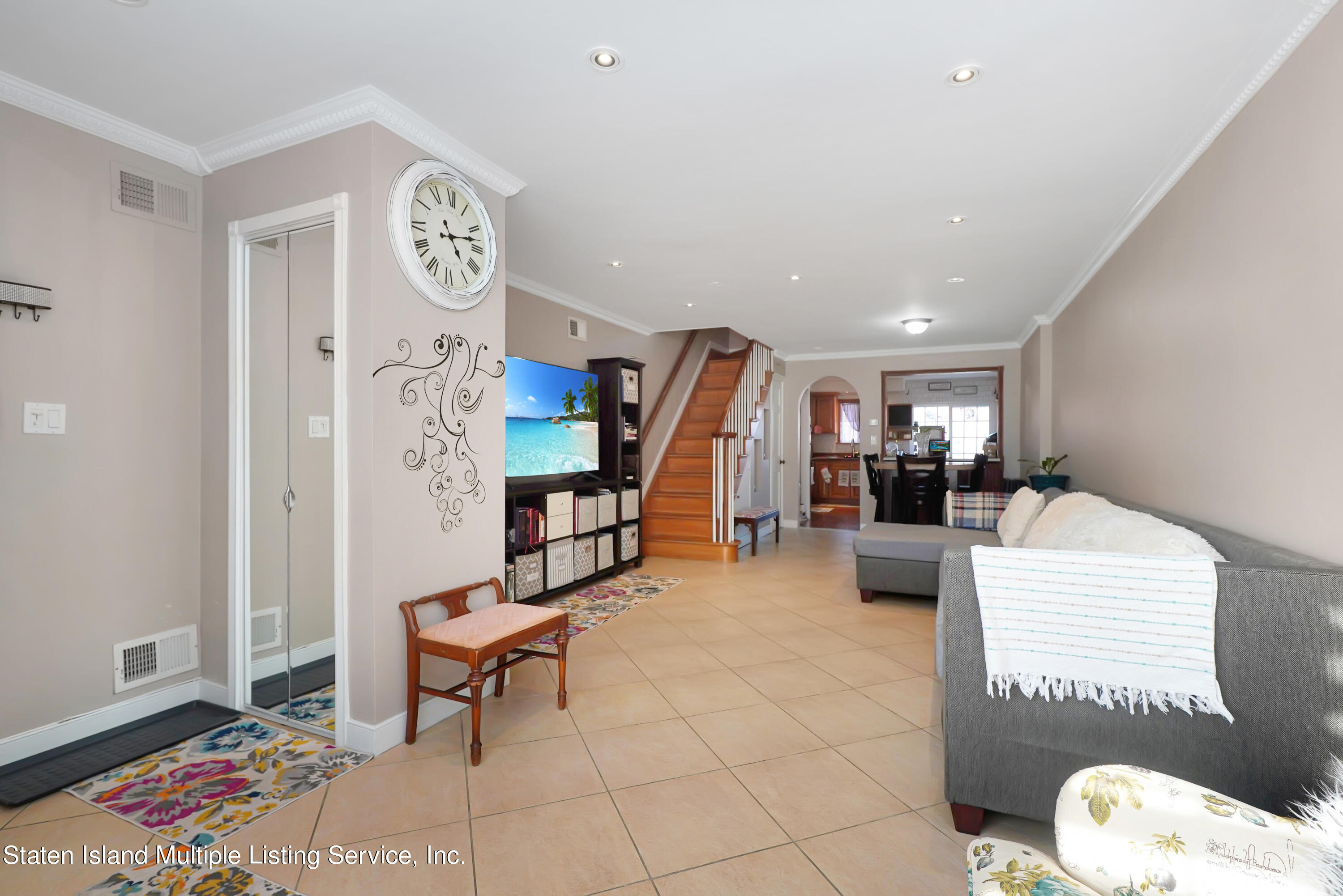 258 Edgewater Street Staten Island, NY 10305 - Photo 4 of 33 a living room with furniture and a table