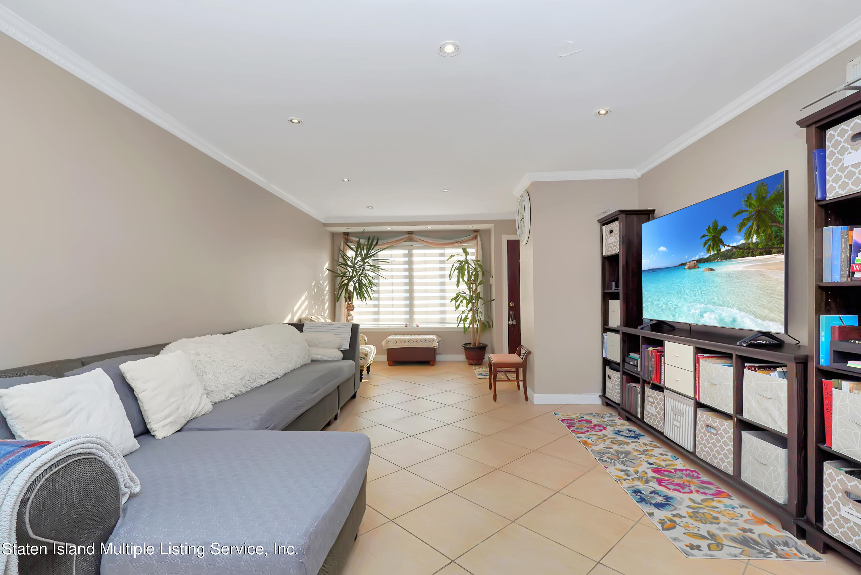 258 Edgewater Street Staten Island, NY 10305 - Photo 6 of 33 a living room with furniture and a flat screen tv