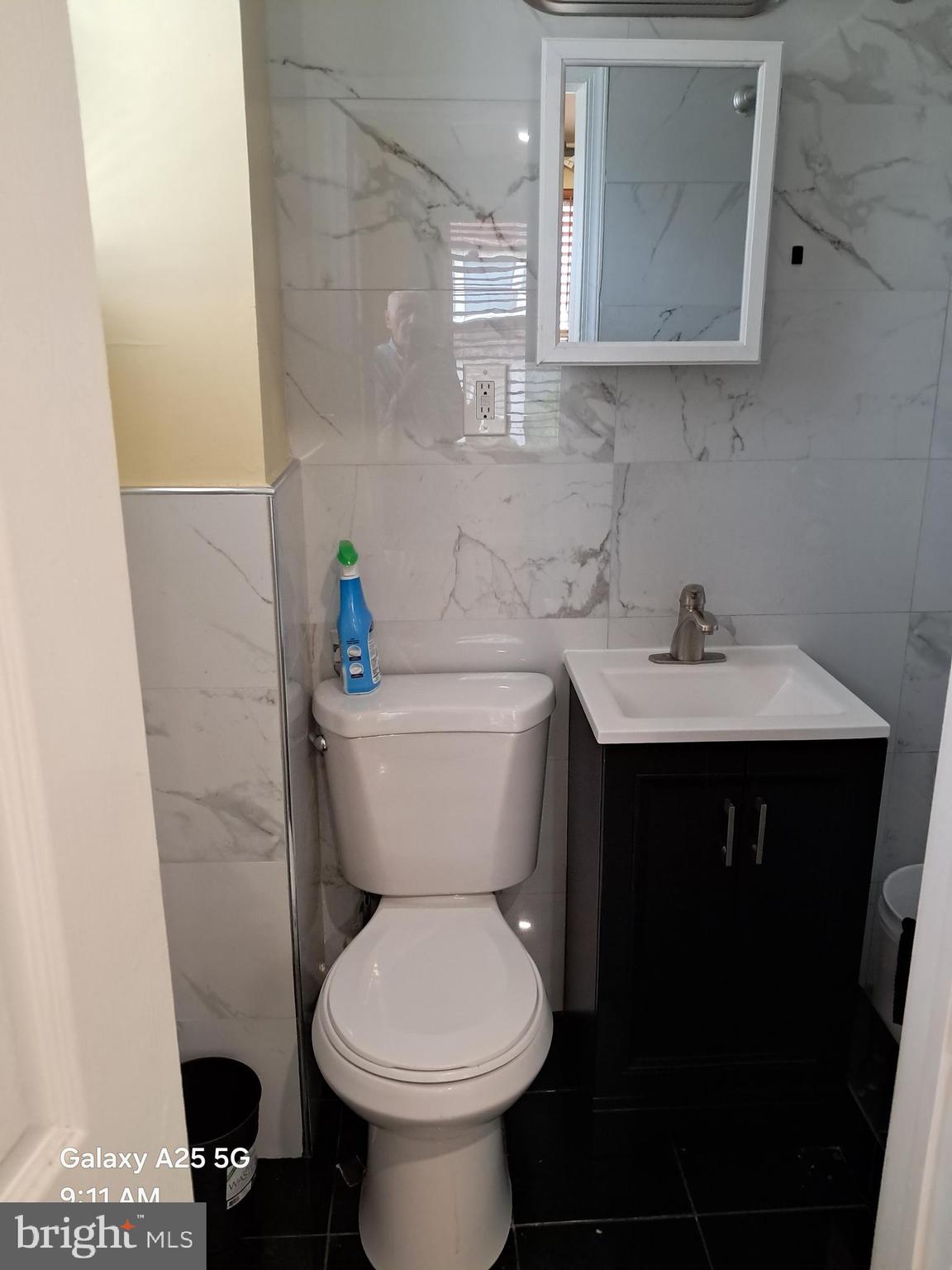 1120 Locust Street, Unit 301 Philadelphia, PA 19107 - Photo 7 of 9 a bathroom with a sink and a toilet