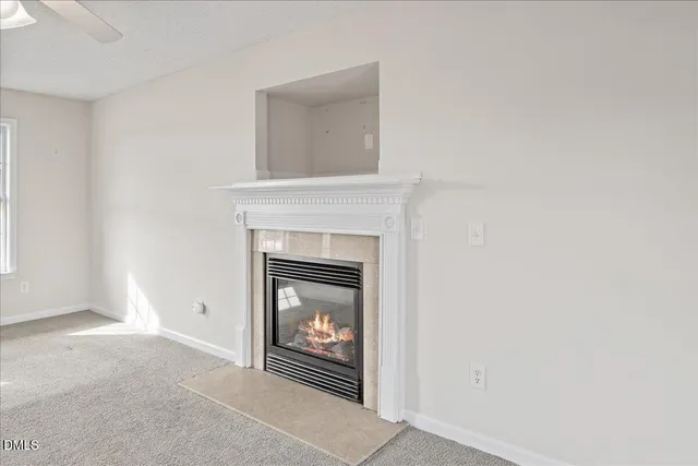 a view of staircase with railing and white walls