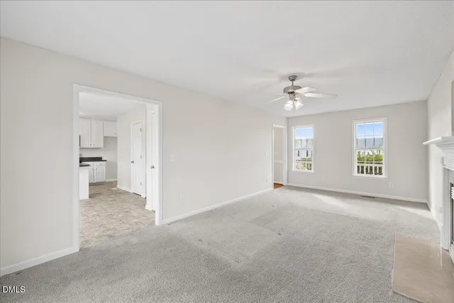 a view of a hallway with stairs