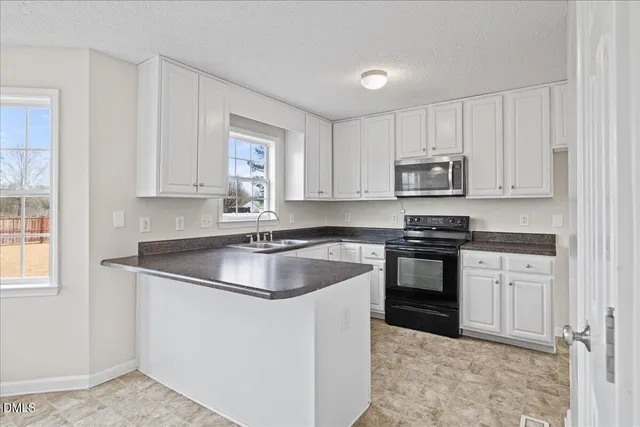 a white bath tub sitting next to a toilet