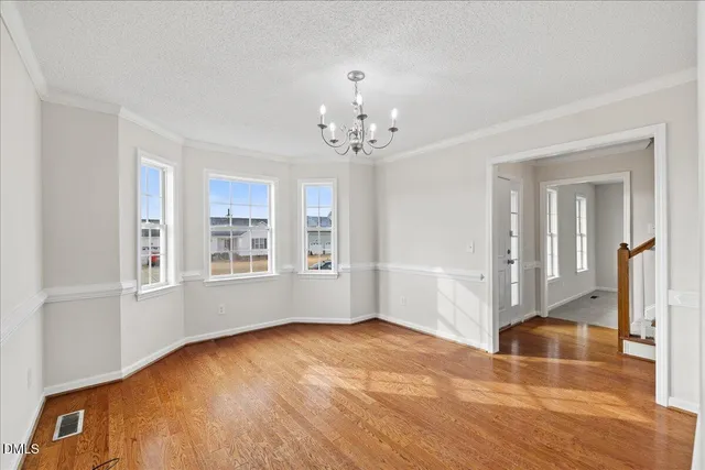 a view of roof deck with wooden floor and city view