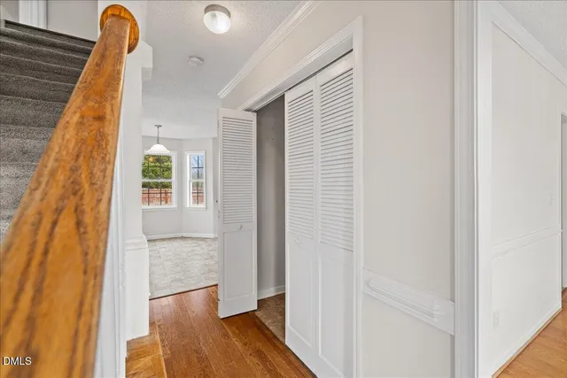 an aerial view of a house with a yard and lake view