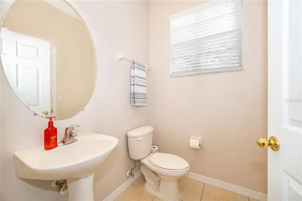 a bathroom with a sink a mirror and a toilet