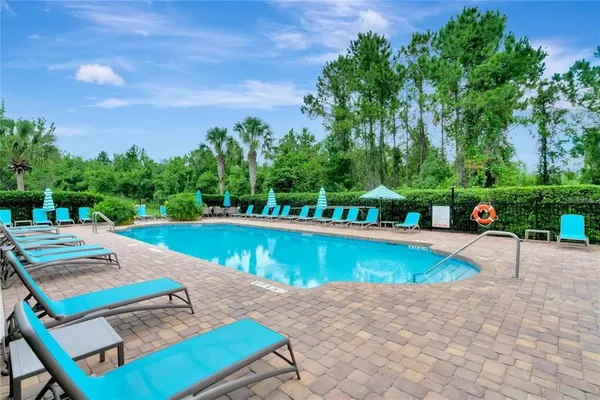 a view of a swimming pool with a patio