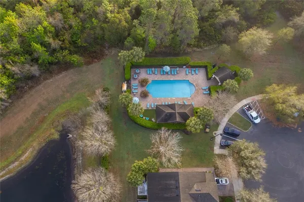 an aerial view of a house with a lake view