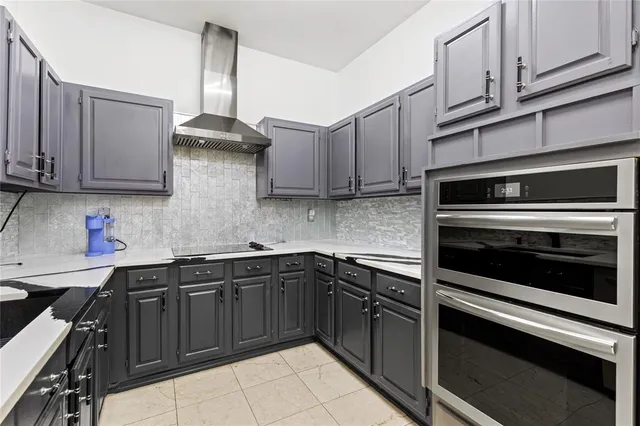 a kitchen with stainless steel appliances granite countertop a sink stove and microwave