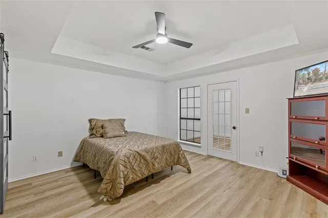 a bedroom with a bed and a cabinets