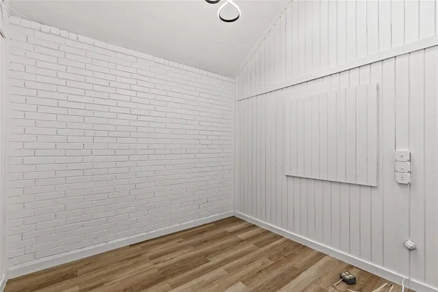 a view of small space with wooden floor