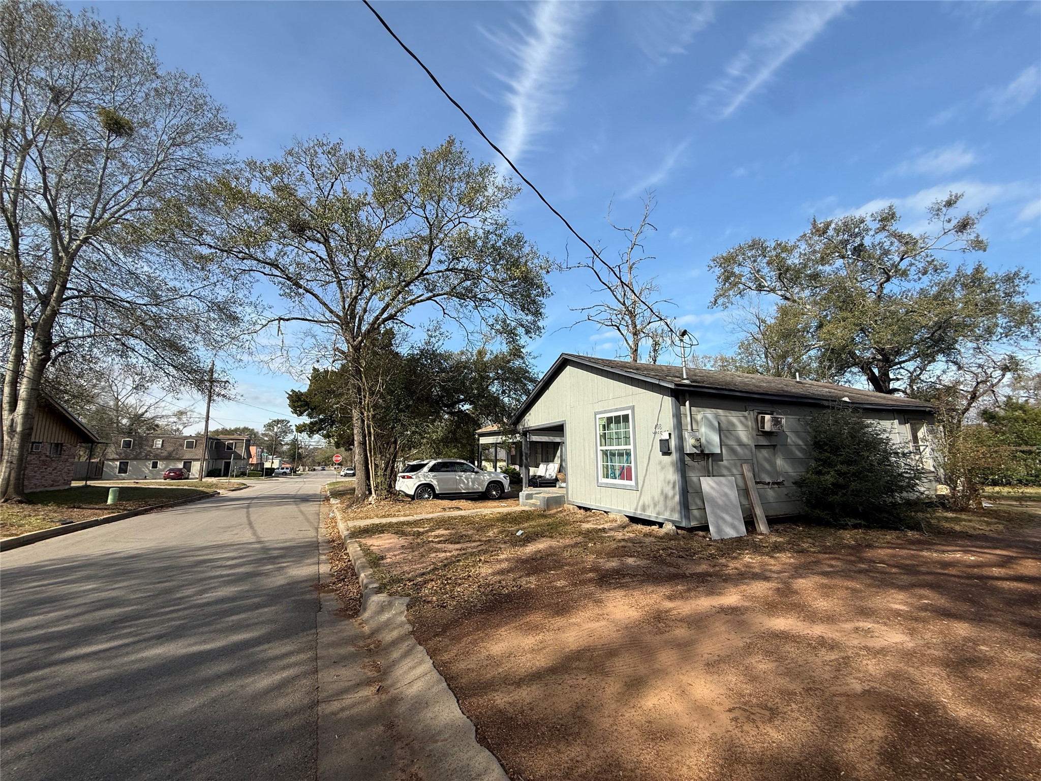 412 Waco Street Conroe, TX 77301 - Photo 12 of 50 a view of a house with a yard