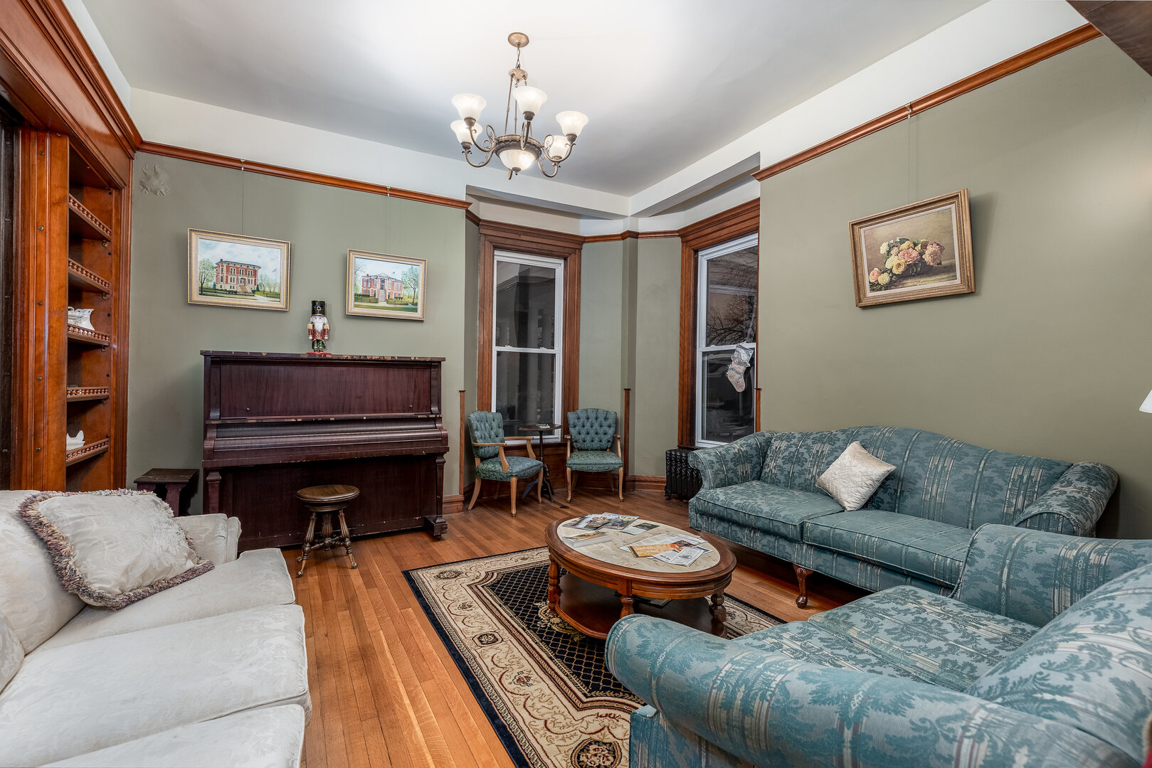 116 West Prospect Avenue Ottawa, IL 61350 - Photo 15 of 73 a living room with furniture a rug and a chandelier