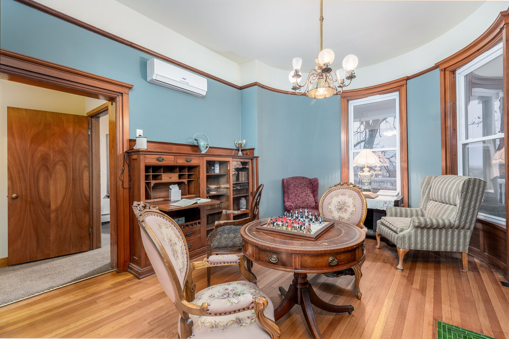 116 West Prospect Avenue Ottawa, IL 61350 - Photo 18 of 73 a living room with furniture a chandelier and a bookshelf