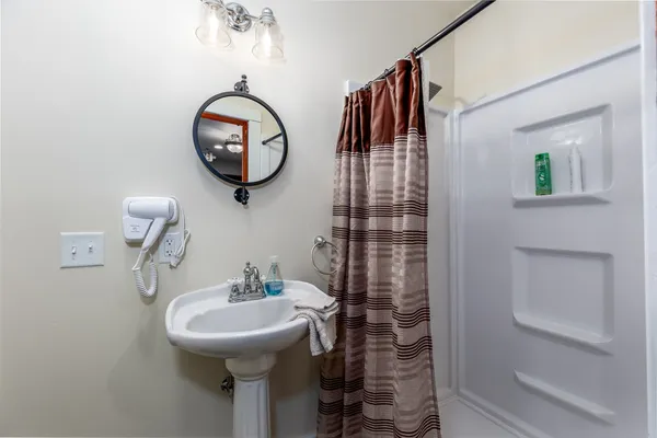 a front view of a building with a garden