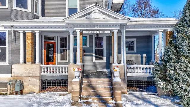 a front view of a building with a porch