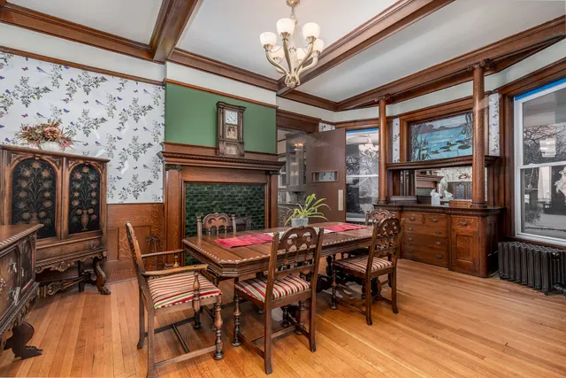 a dining room with furniture and wooden floor