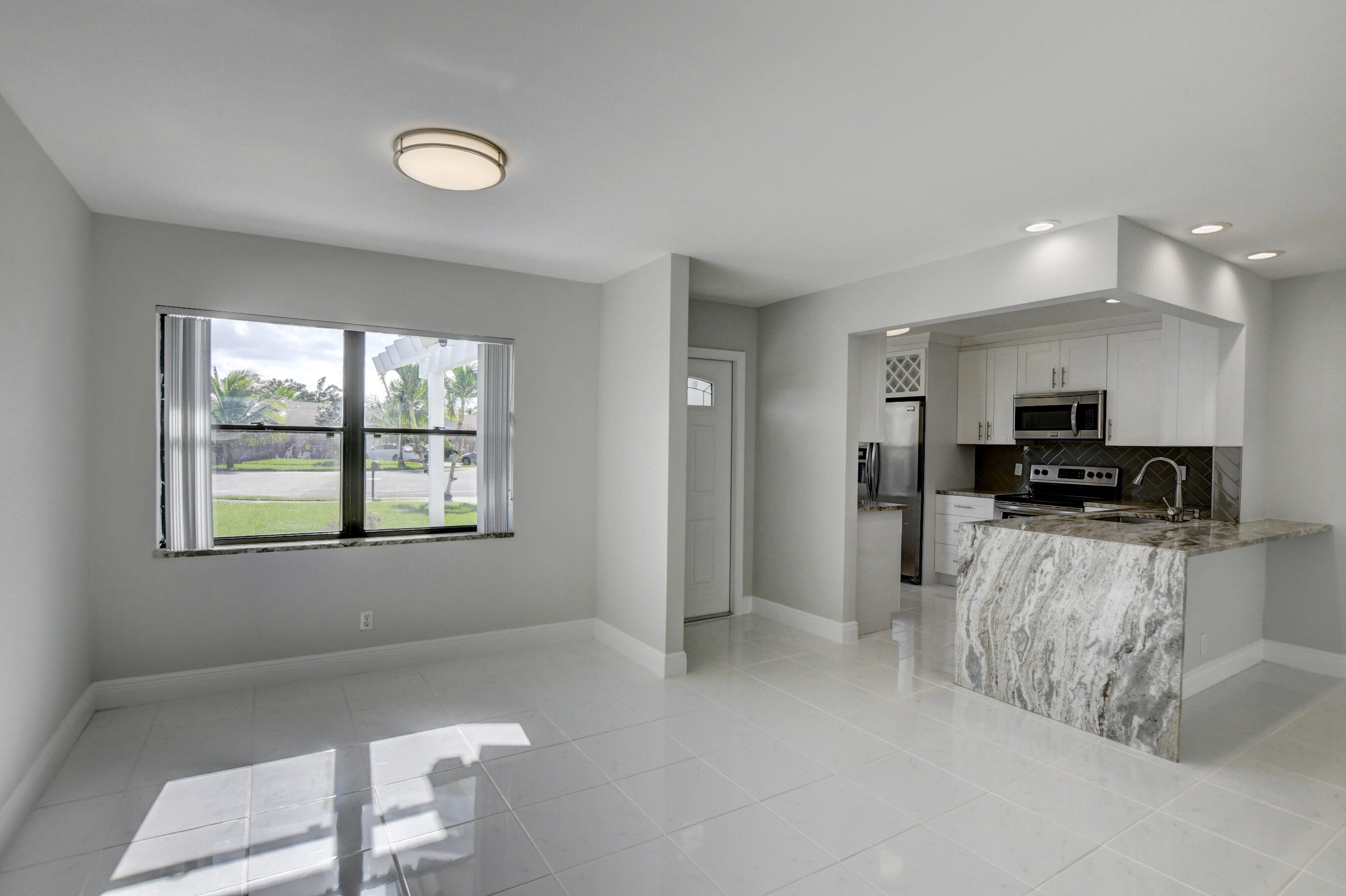9501 Lancaster Place Boca Raton, FL 33434 - Photo 16 of 57 Dinning Room and Kitchen View
