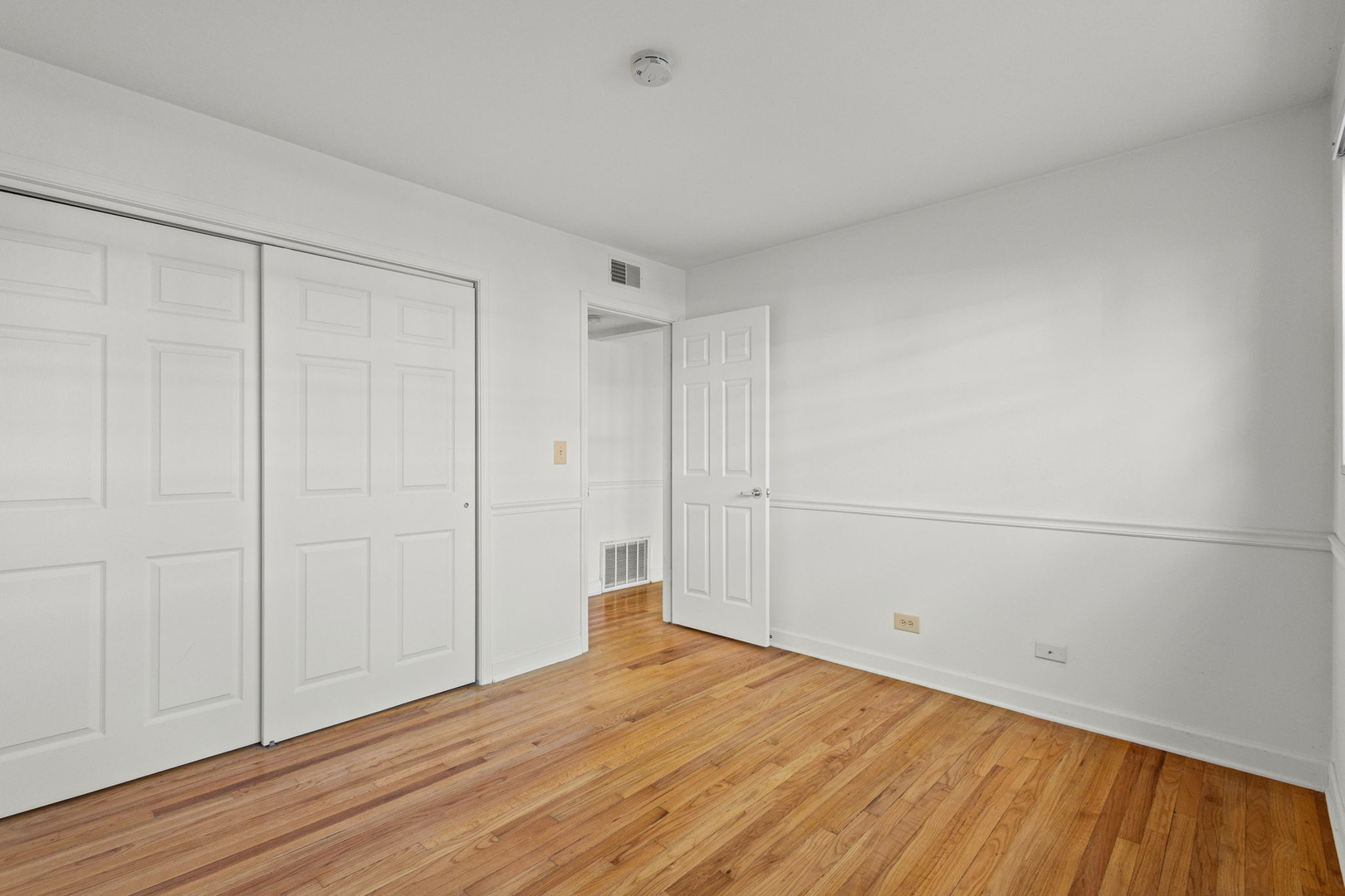169 East Palatine Road, Unit E Palatine, IL 60067 - Photo 16 of 24 a view of empty room with wooden floor