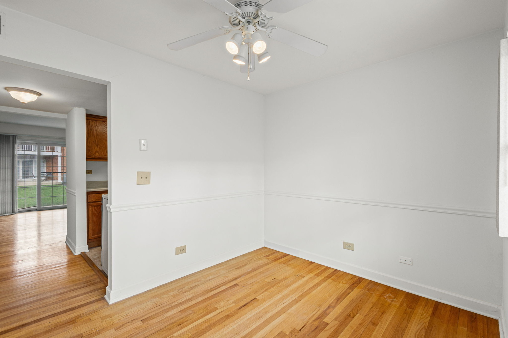 169 East Palatine Road, Unit E Palatine, IL 60067 - Photo 3 of 24 a view of empty room with wooden floor