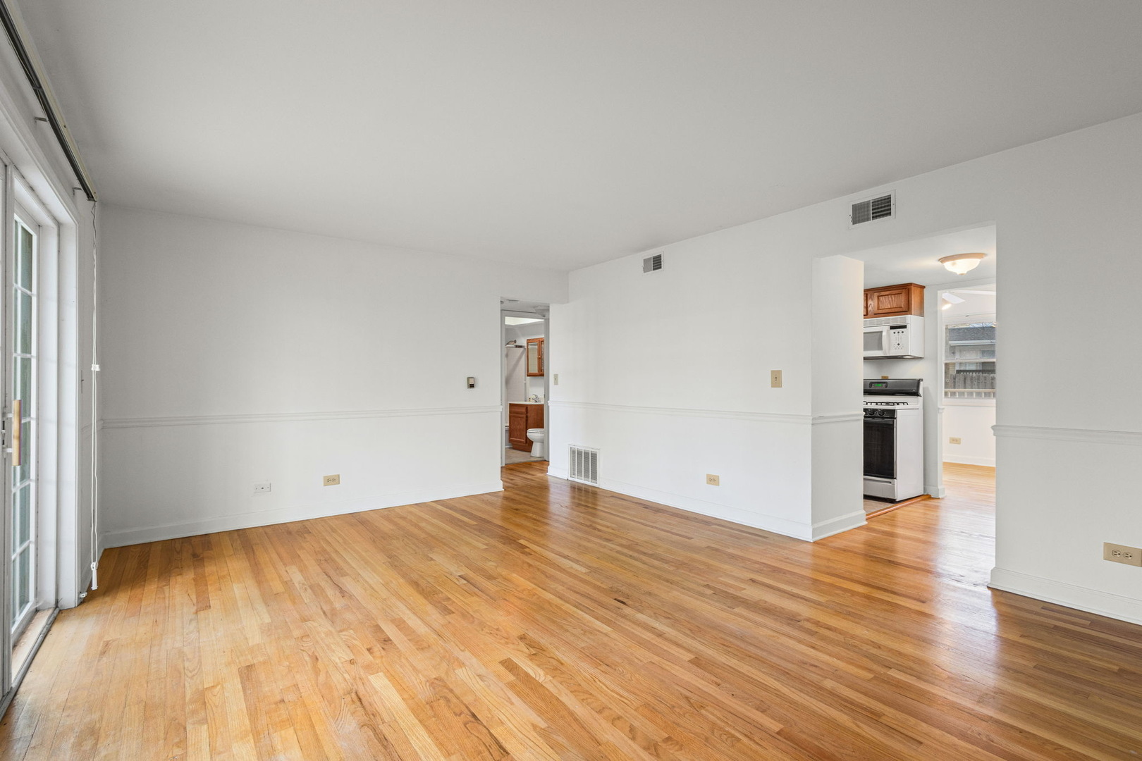 169 East Palatine Road, Unit E Palatine, IL 60067 - Photo 10 of 24 a view of empty room with wooden floor
