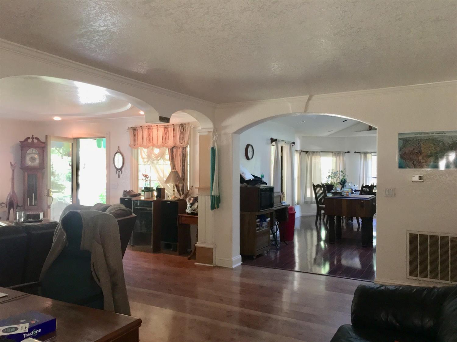 300 Grange Road Grants Pass, OR 97526 - Photo 19 of 27 a living room with furniture two window and wooden floor
