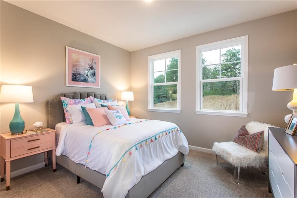 4840 Montane Street Cumming, GA 30028 - Photo 11 of 34 a bedroom with bed and a window