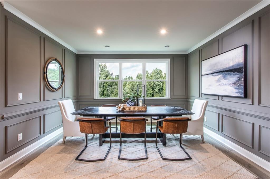 4840 Montane Street Cumming, GA 30028 - Photo 13 of 34 a view of a dining room with furniture window and wooden floor