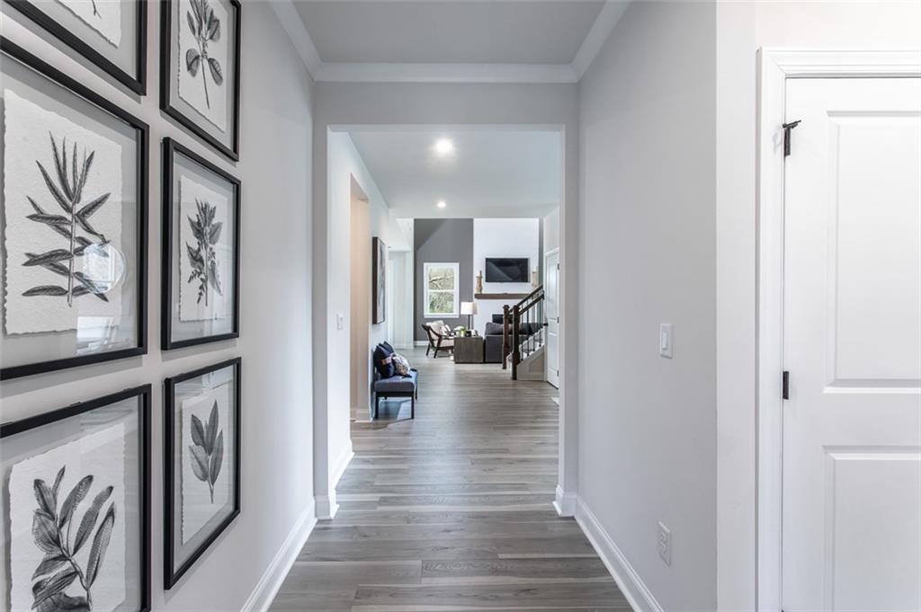 4840 Montane Street Cumming, GA 30028 - Photo 14 of 34 a view of a hallway with dining area