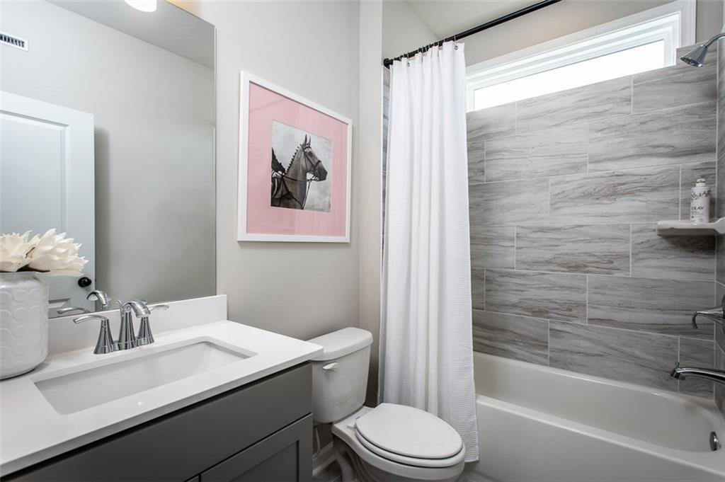 4840 Montane Street Cumming, GA 30028 - Photo 16 of 34 a bathroom with a sink toilet and shower