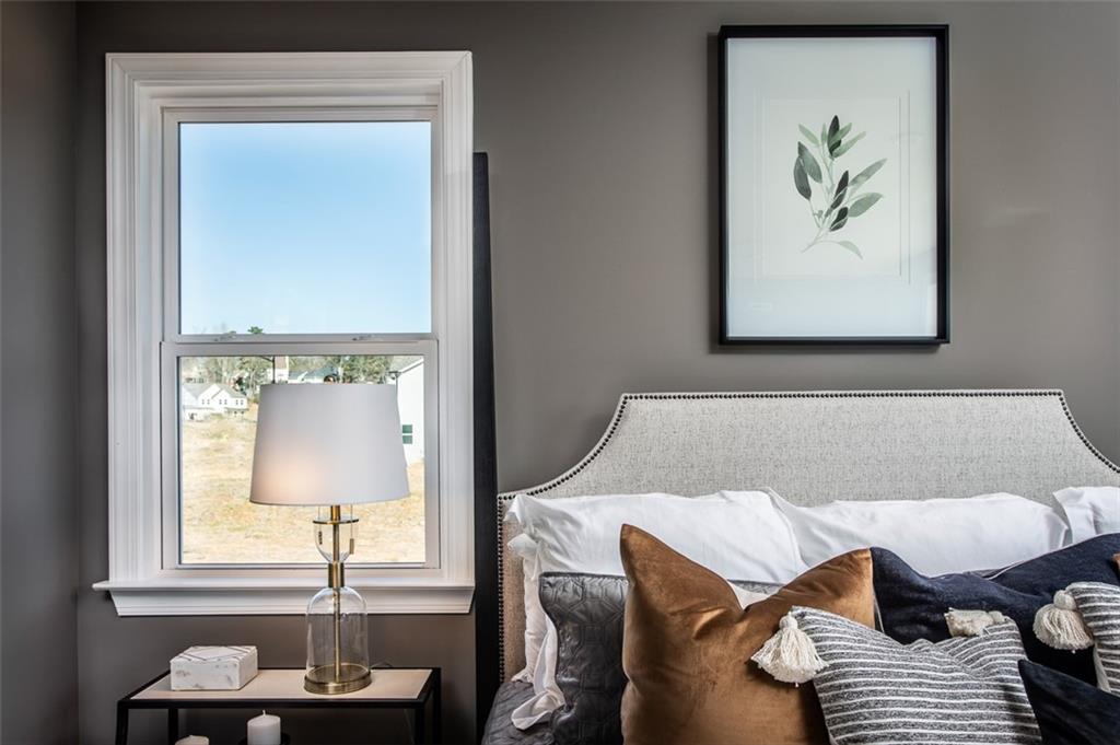 4840 Montane Street Cumming, GA 30028 - Photo 22 of 34 a living room with furniture and a window