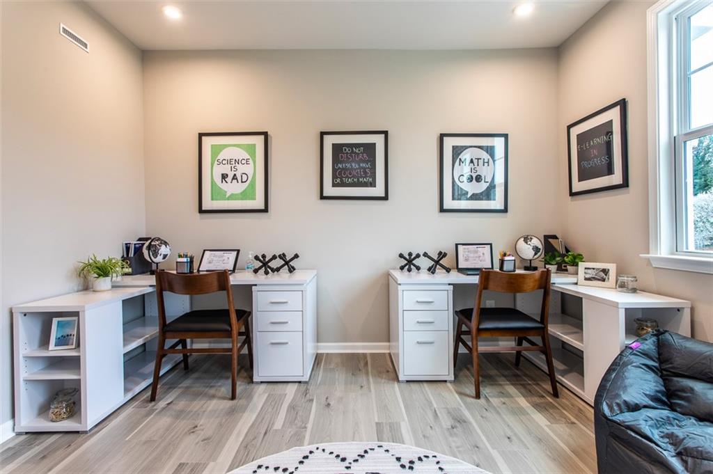4840 Montane Street Cumming, GA 30028 - Photo 23 of 34 a view of a workspace with furniture and a workspace