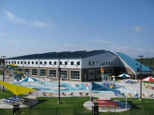 4840 Montane Street Cumming, GA 30028 - Photo 27 of 34 a front view of house with swimming pool and yard