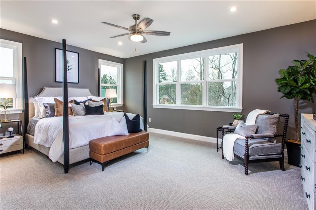 4840 Montane Street Cumming, GA 30028 - Photo 8 of 34 a bedroom with bed and a large window