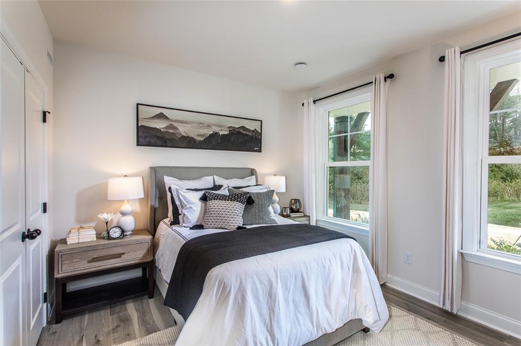 4840 Montane Street Cumming, GA 30028 - Photo 10 of 34 a bedroom with a bed and a window