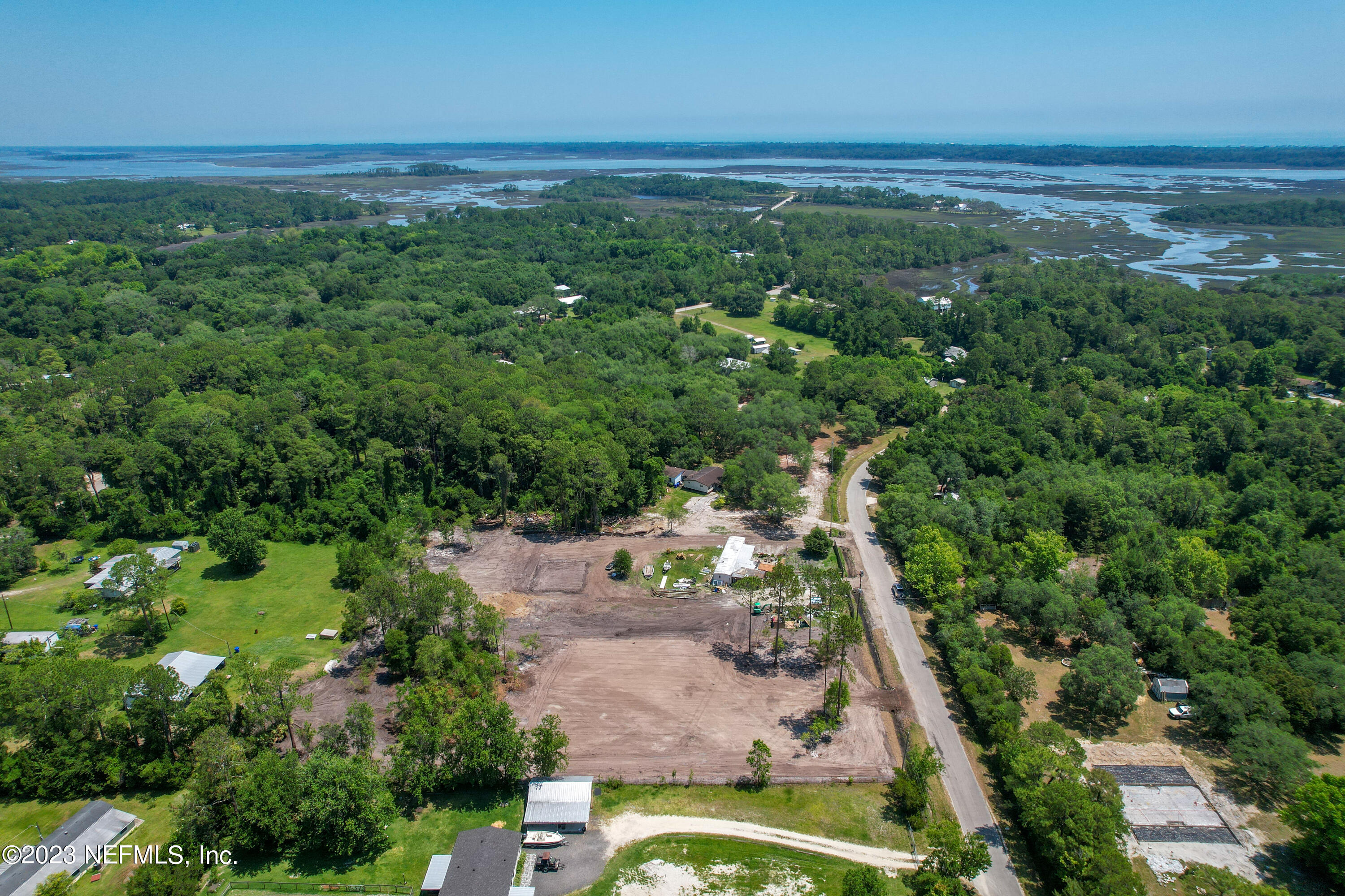 336 Dusty Road St. Augustine, FL 32095 - Photo 1 of 10 an aerial view of a residential houses with outdoor space and trees all around