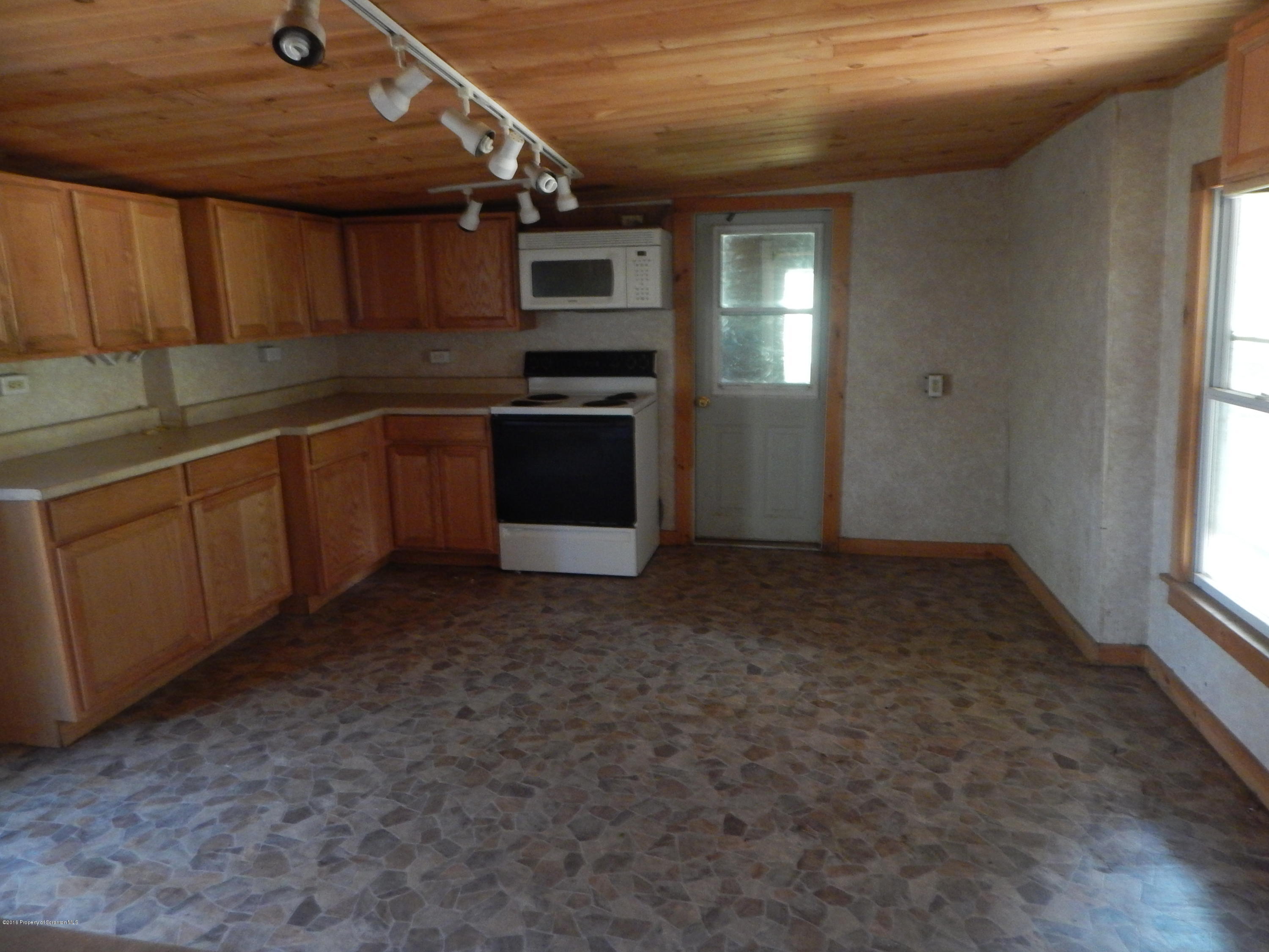 3221 State Rte 3010 Springville, PA 18844 - Photo 6 of 20 a kitchen with stainless steel appliances granite countertop a sink a stove and cabinets