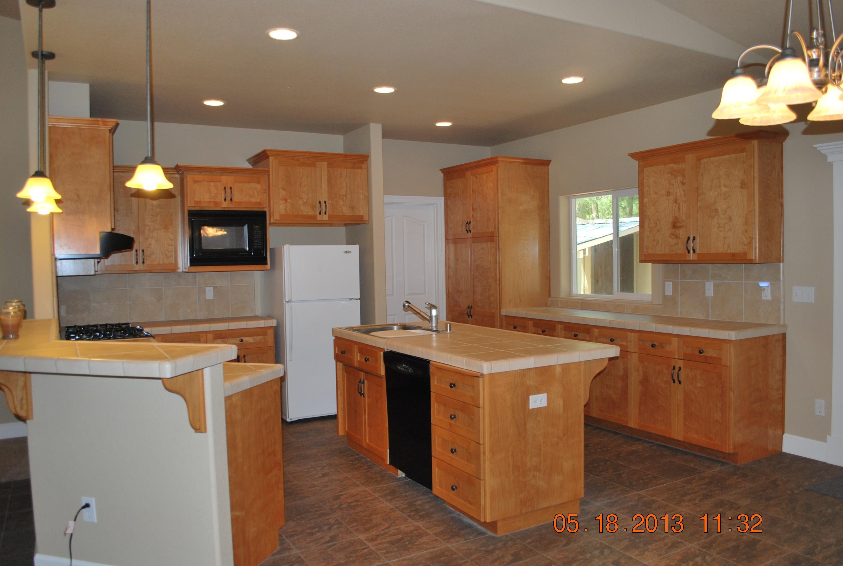 10271 Ritts Mill Road Shingletown, CA 96088 - Photo 2 of 29 a kitchen with stainless steel appliances granite countertop a sink a stove and a refrigerator
