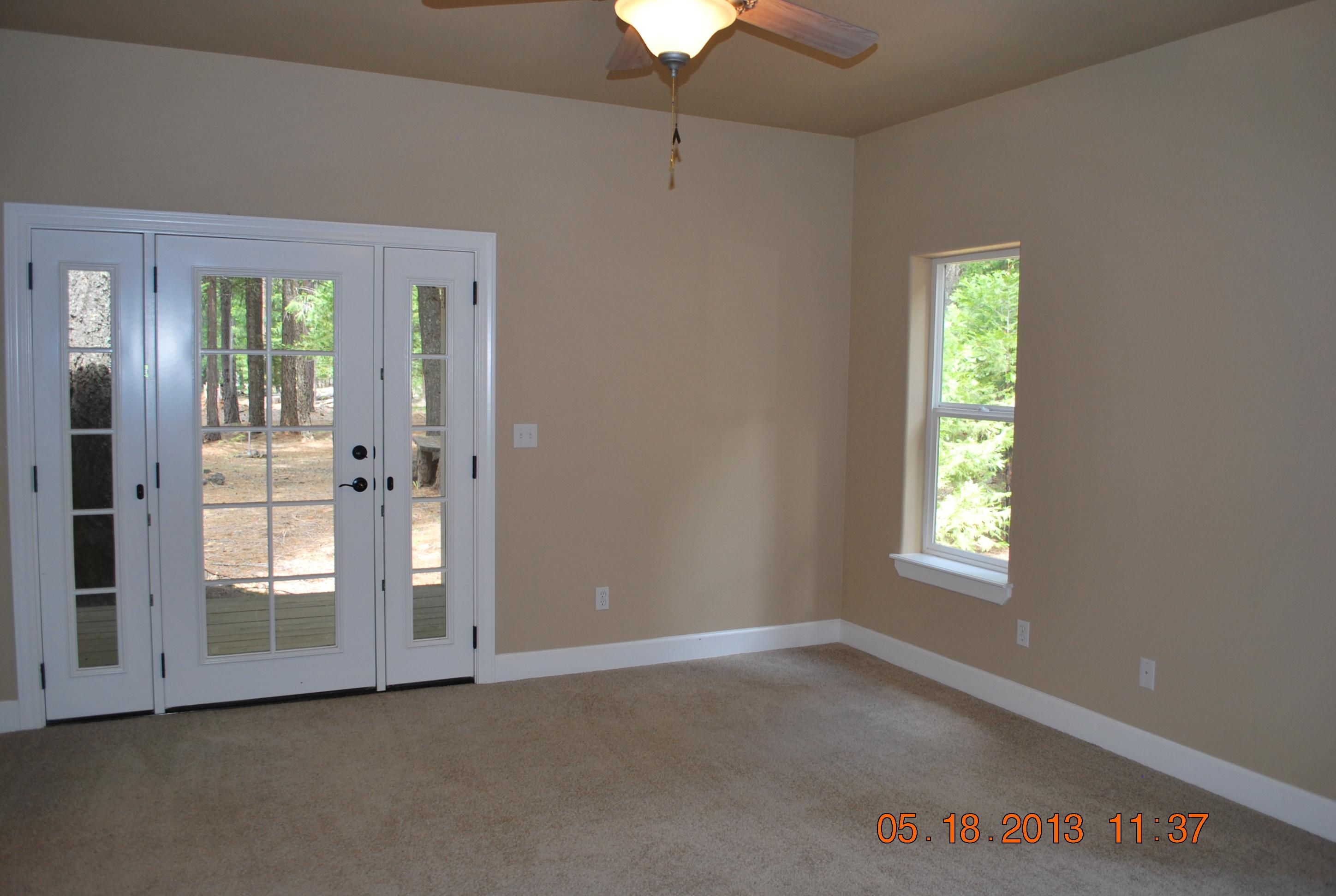 10271 Ritts Mill Road Shingletown, CA 96088 - Photo 7 of 29 an empty room with windows and entrance
