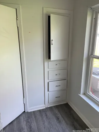a bathroom with a sink toilet and mirror