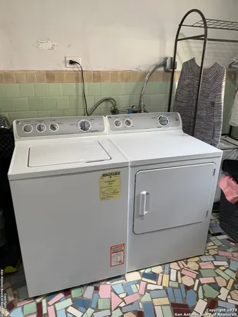 a utility room with dryer and washer