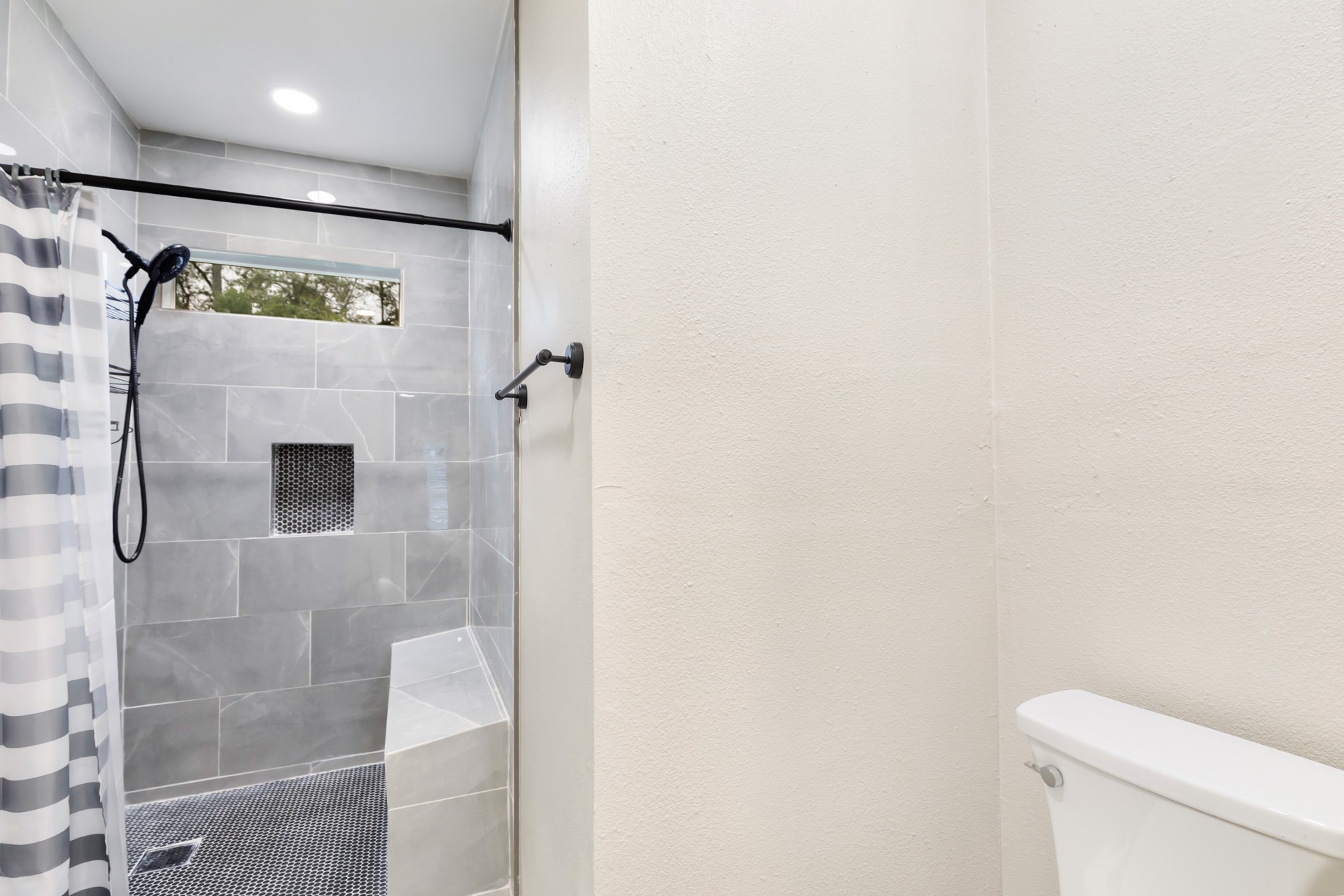 4231 Hartsville Road Houston, TX 77047 - Photo 20 of 23 a bathroom with a shower and a toilet