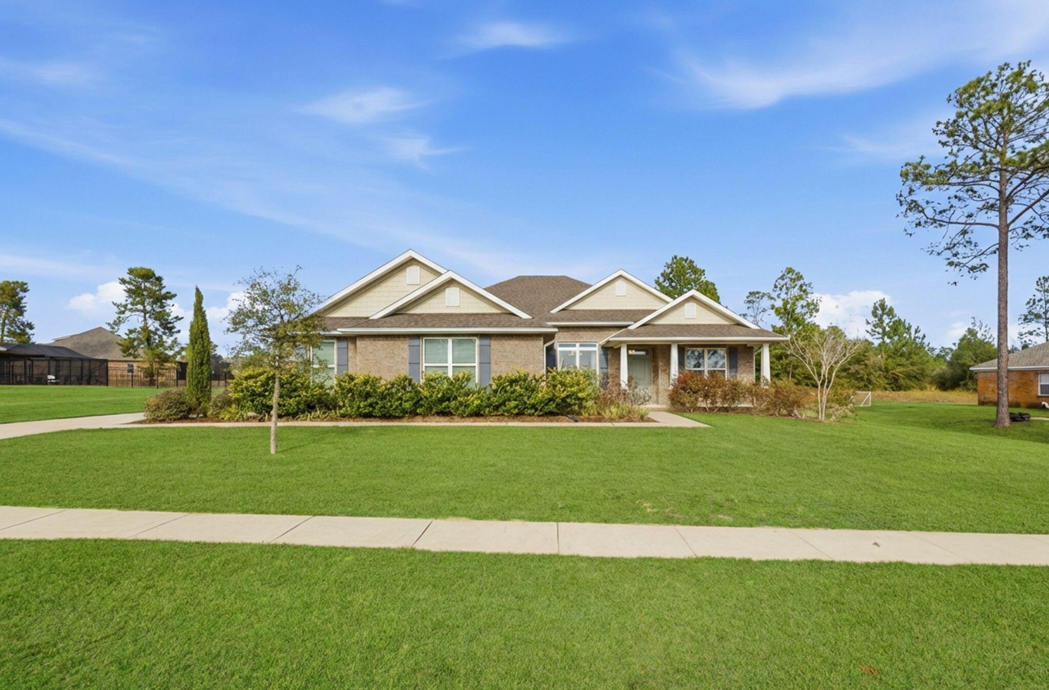 a front view of a house with a yard