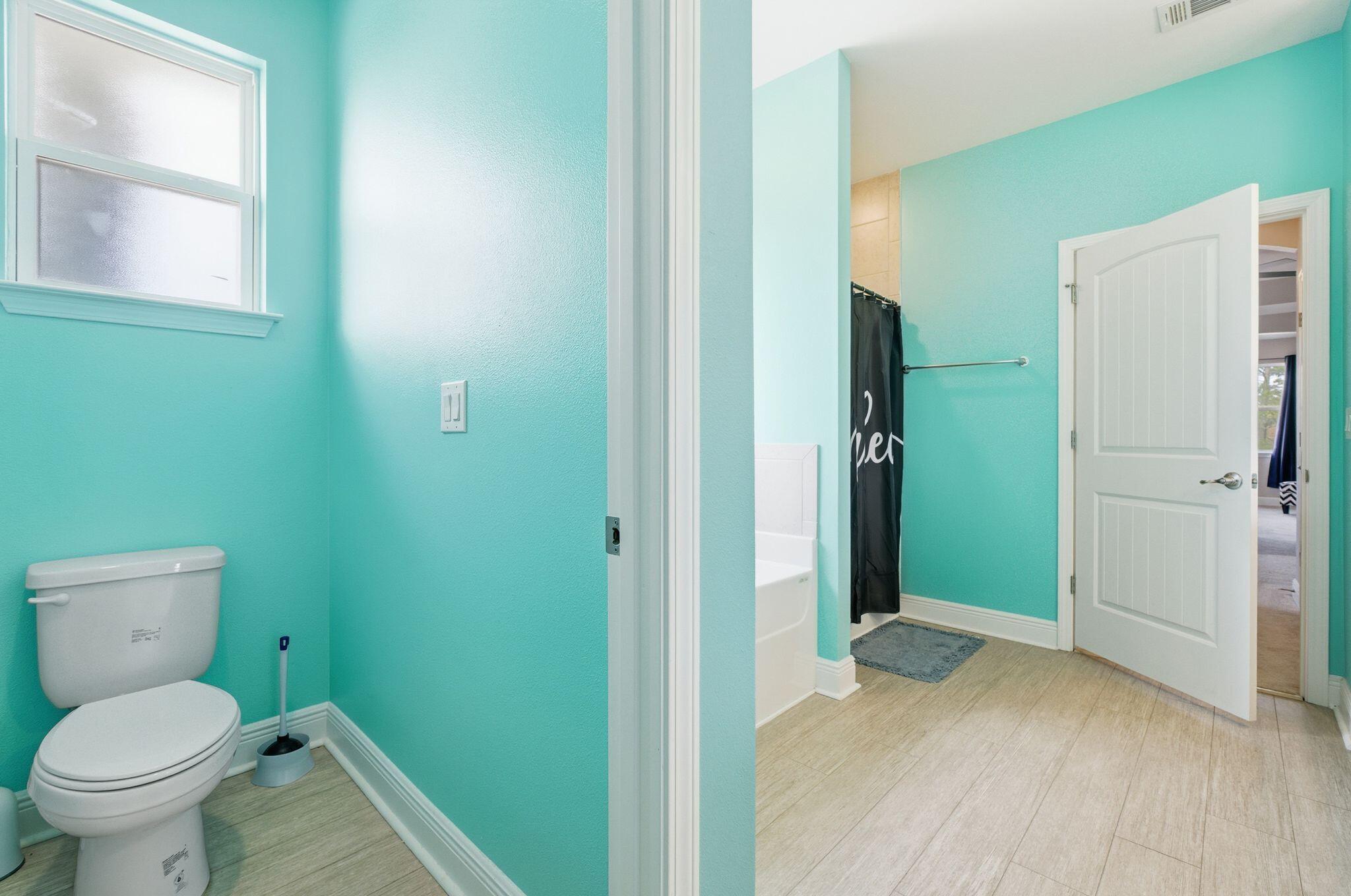 334 Tournament Lane Freeport, FL 32439 - Photo 17 of 27 a bathroom with a toilet and a shower