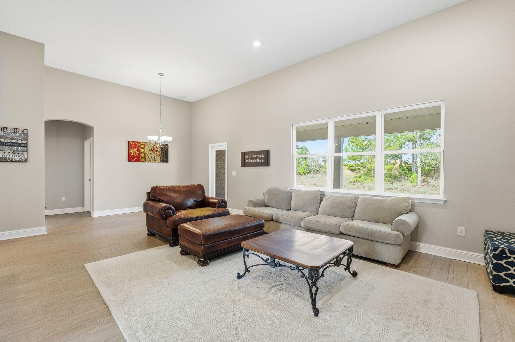 334 Tournament Lane Freeport, FL 32439 - Photo 3 of 27 a living room with furniture and a window