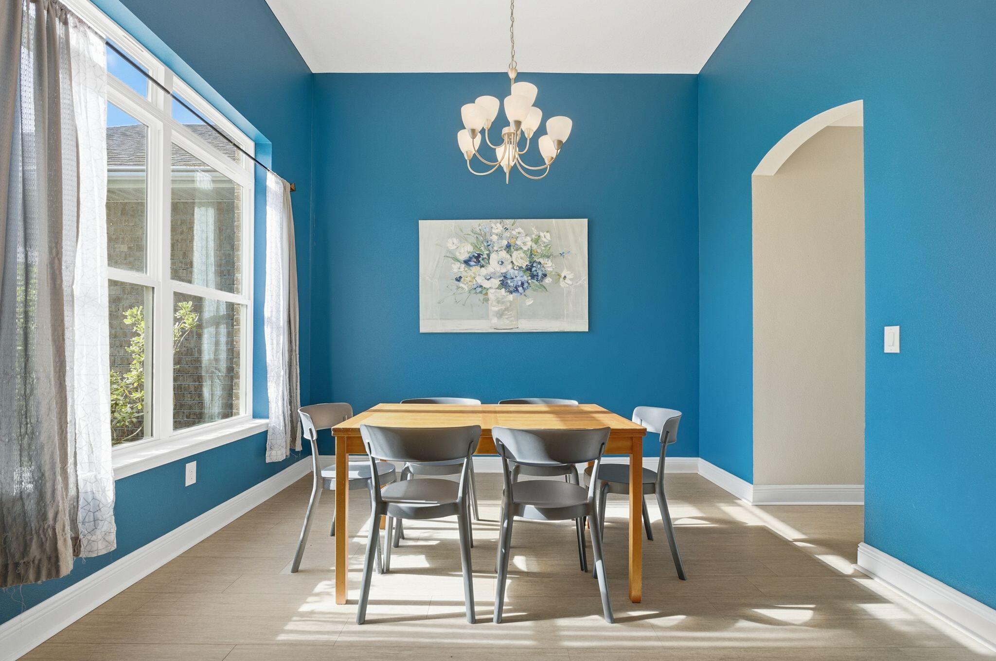 334 Tournament Lane Freeport, FL 32439 - Photo 7 of 27 a dining room with furniture and chandelier
