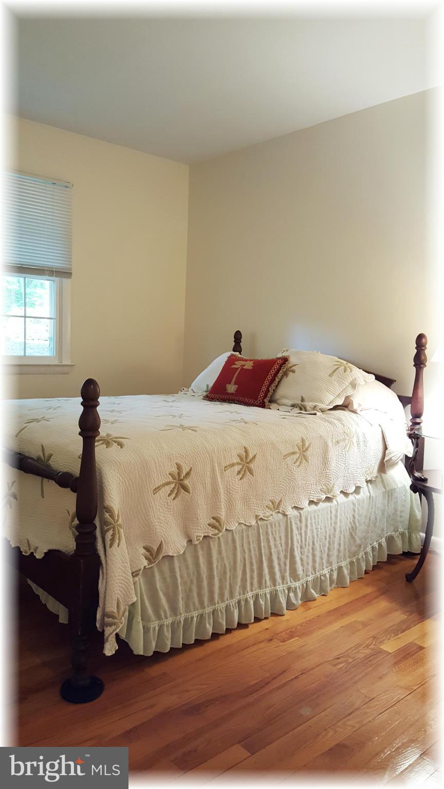 12009 Caspian Road Kingsville, MD 21087 - Photo 22 of 30 2nd bedroom offers gleaming hardwood floors.