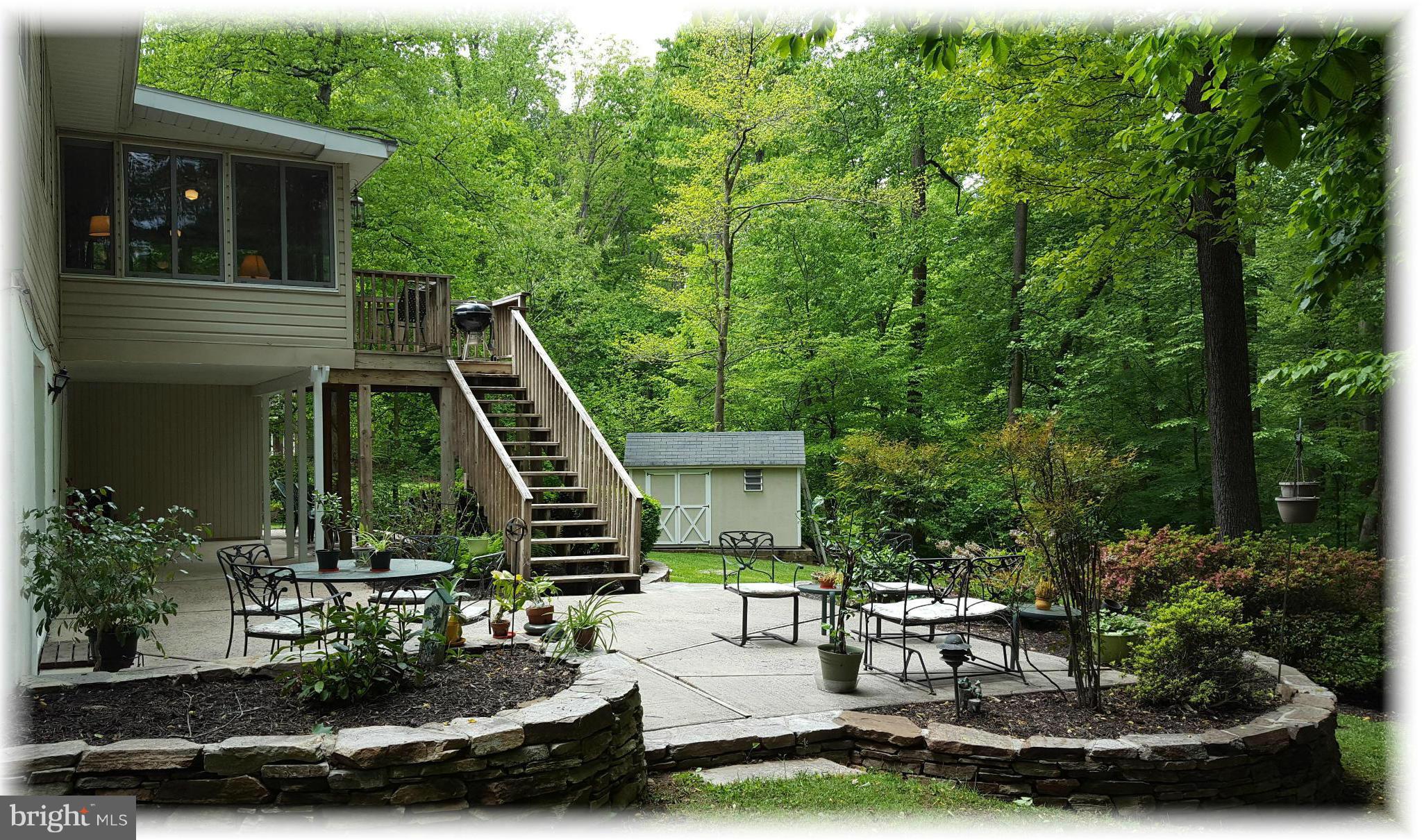12009 Caspian Road Kingsville, MD 21087 - Photo 5 of 30 Huge patio surrounded natural stone landscapes.